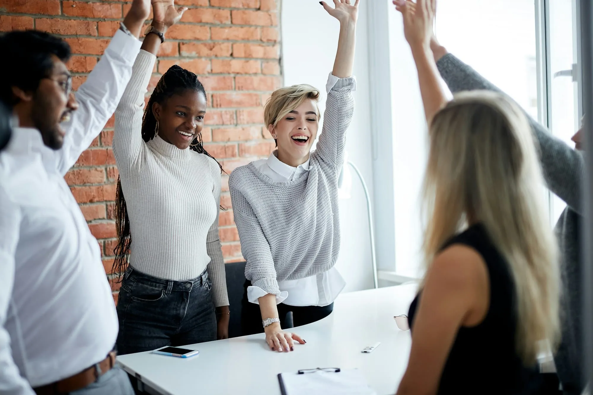 Group of happy people celebrating a triumph