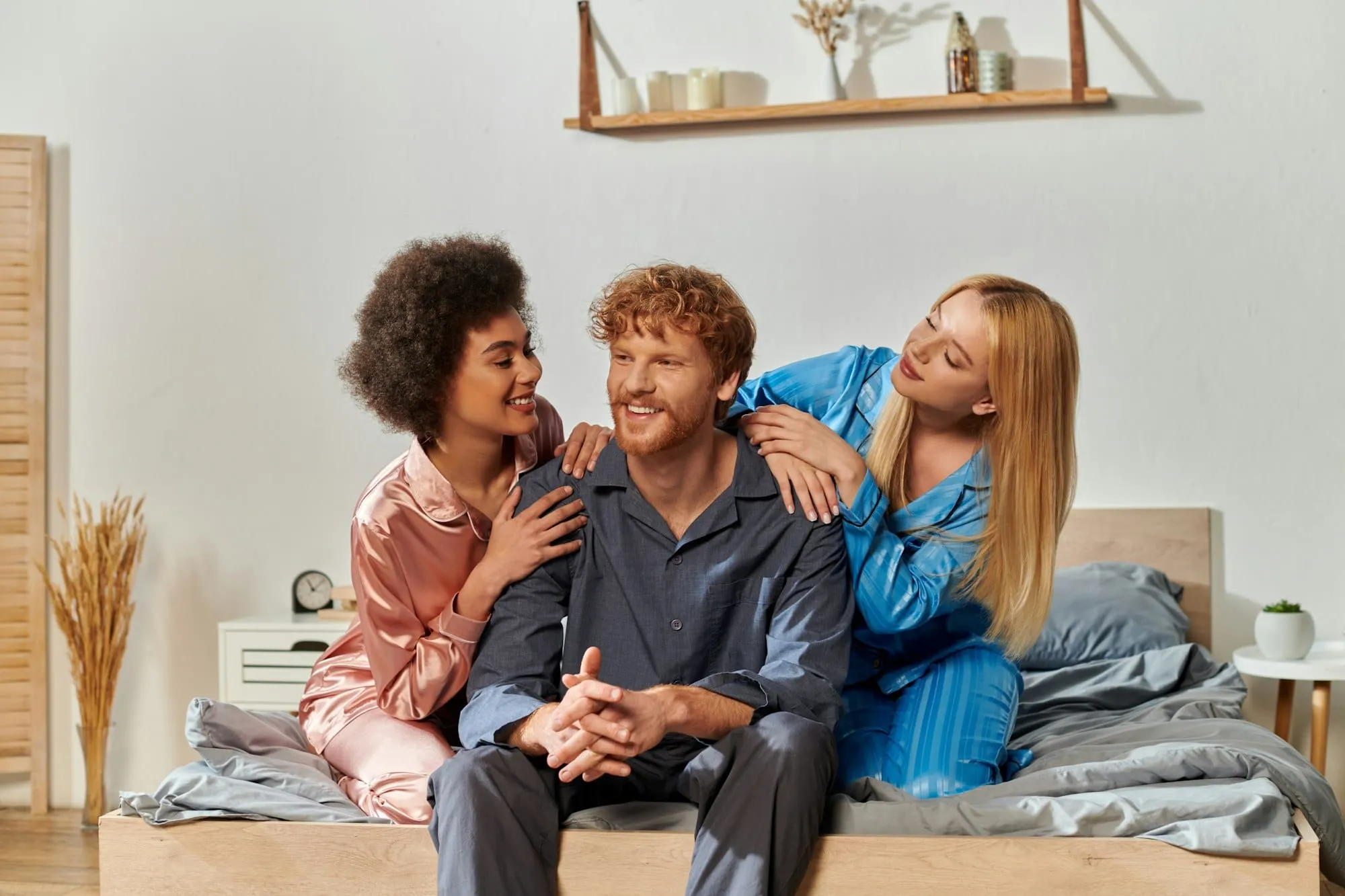 polyamory concept, open relationship, polygamy, three adults, happy redhead man and multicultural