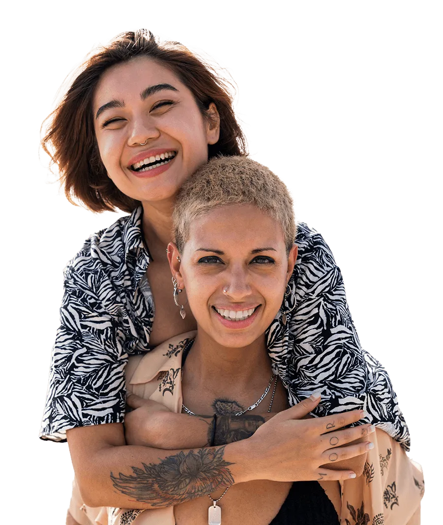Two friends smiling and embracing