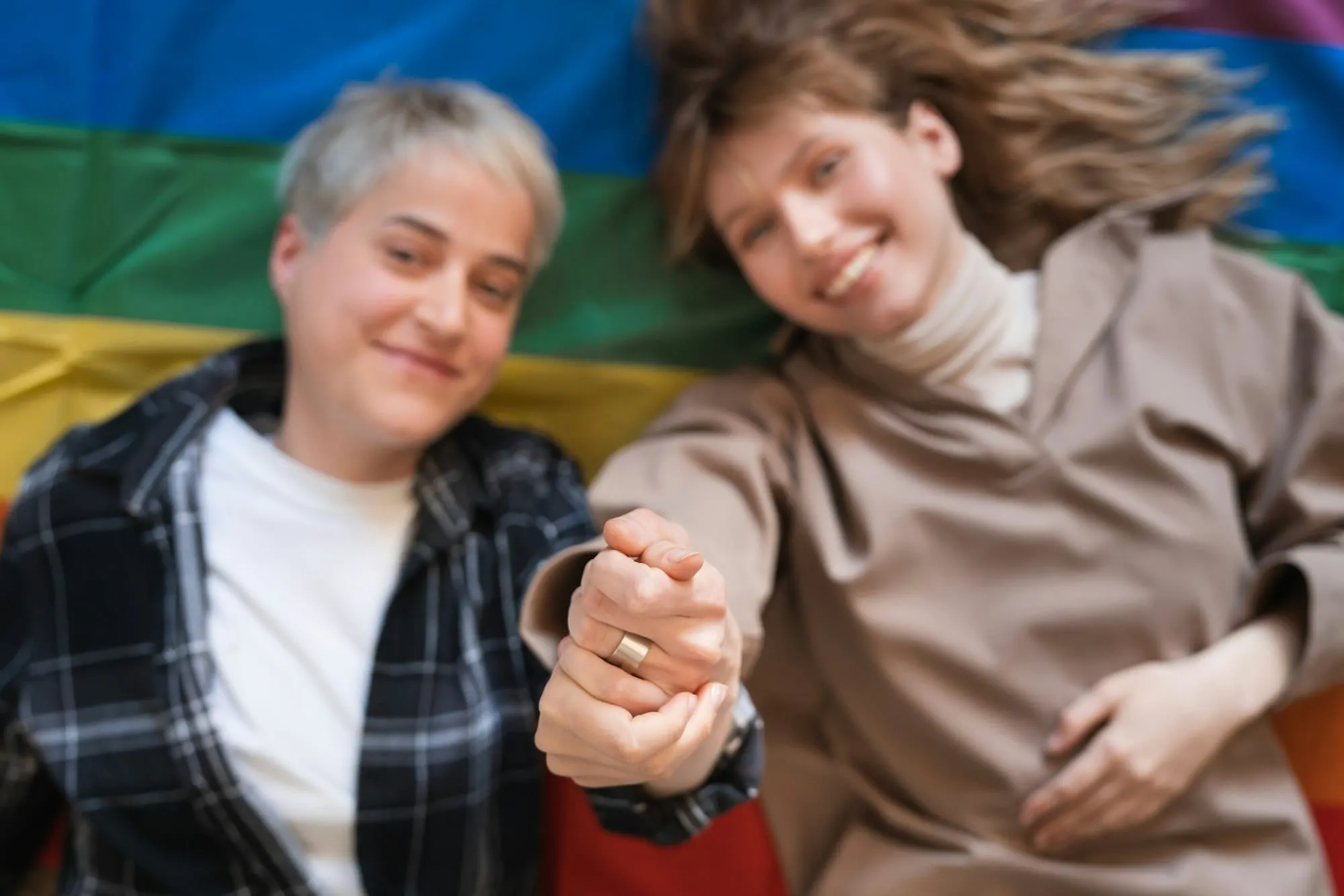 A couple holding hands and smiling together